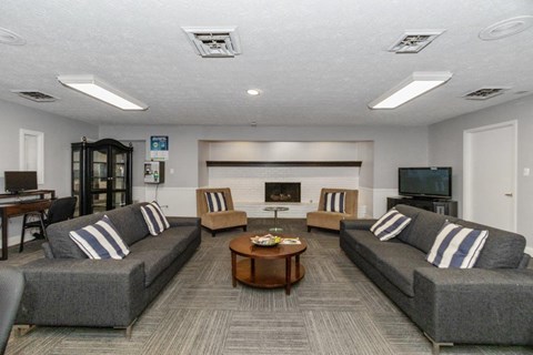 a living room with couches and a table