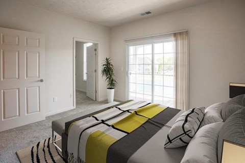 a bedroom with a bed and a large window