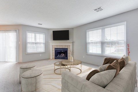 a living room with a couch and a fireplace