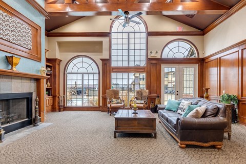 A large room with a fireplace and a couch.