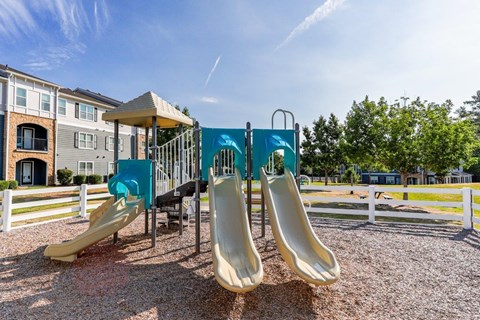 a playground with a bunch of slides on it