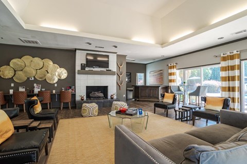 A living room with a fireplace and a large couch.