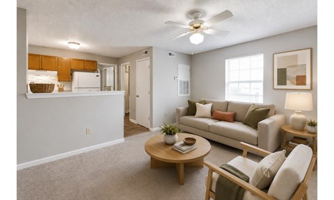 A living room with a couch, chair, and coffee table.