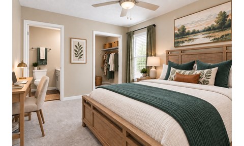A bedroom with a large bed and a painting on the wall.