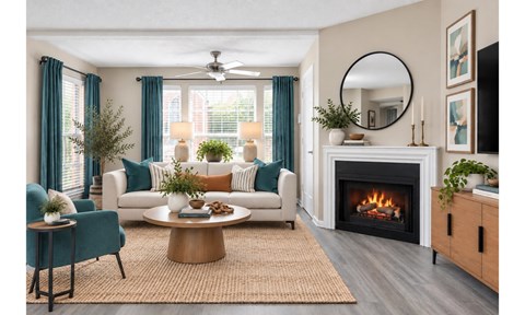 A living room with a fireplace and a blue chair.
