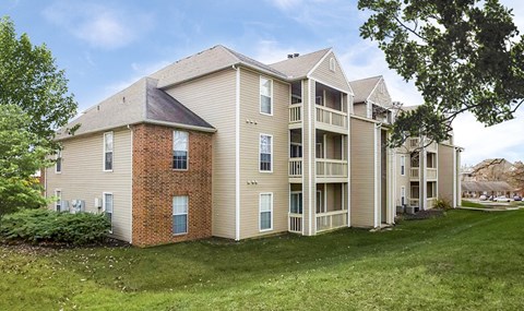 A large apartment complex with multiple buildings and balconies.