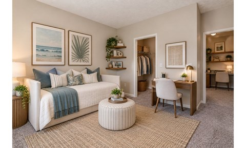 A cozy bedroom with a bed, desk, and chair.