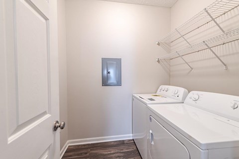A laundry room with a washer and dryer.