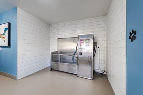 A large industrial freezer is in a room with white walls.