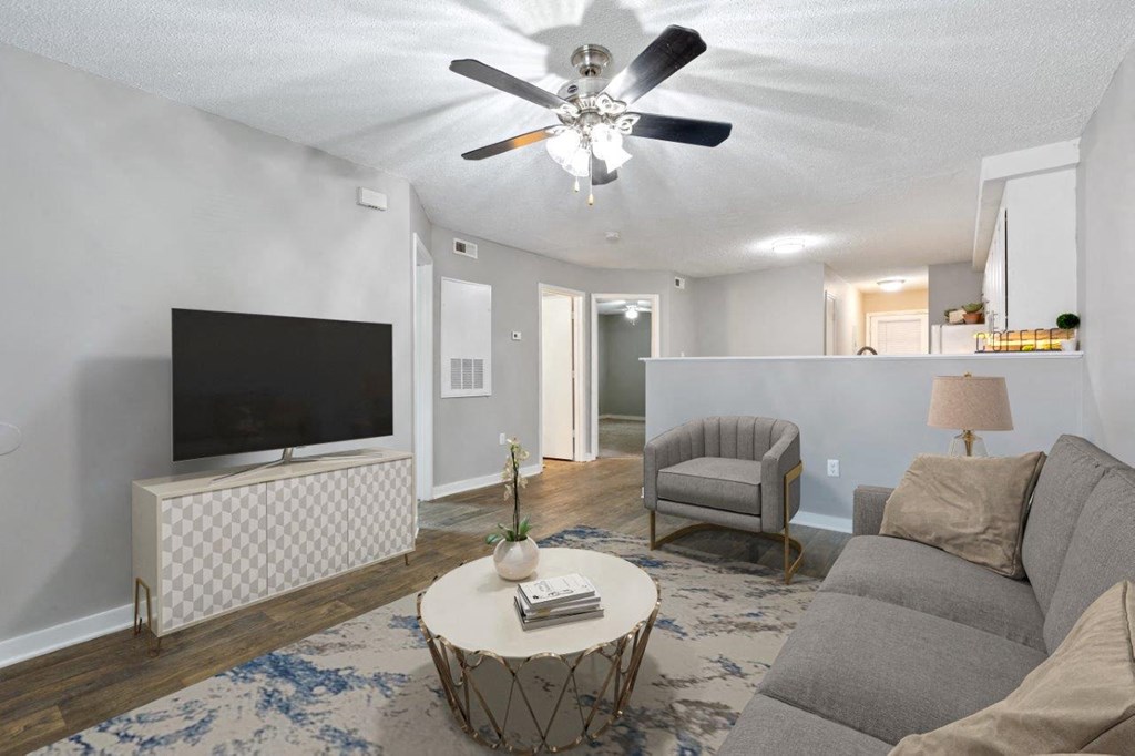 staged living room with wall to wall carpeting