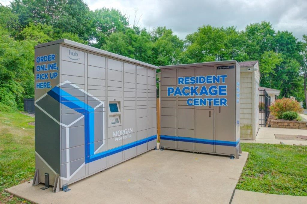 a small parking lot with two small buildings next to each other