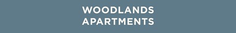 The image displays the words "Woodlands Apartments" in a large, bold font.