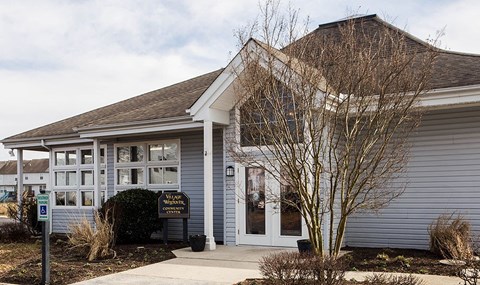 a white building with a sign in front of it