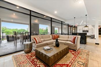A living room with a large sofa and a coffee table.
