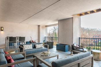 A modern living room with a large sofa and a coffee table.