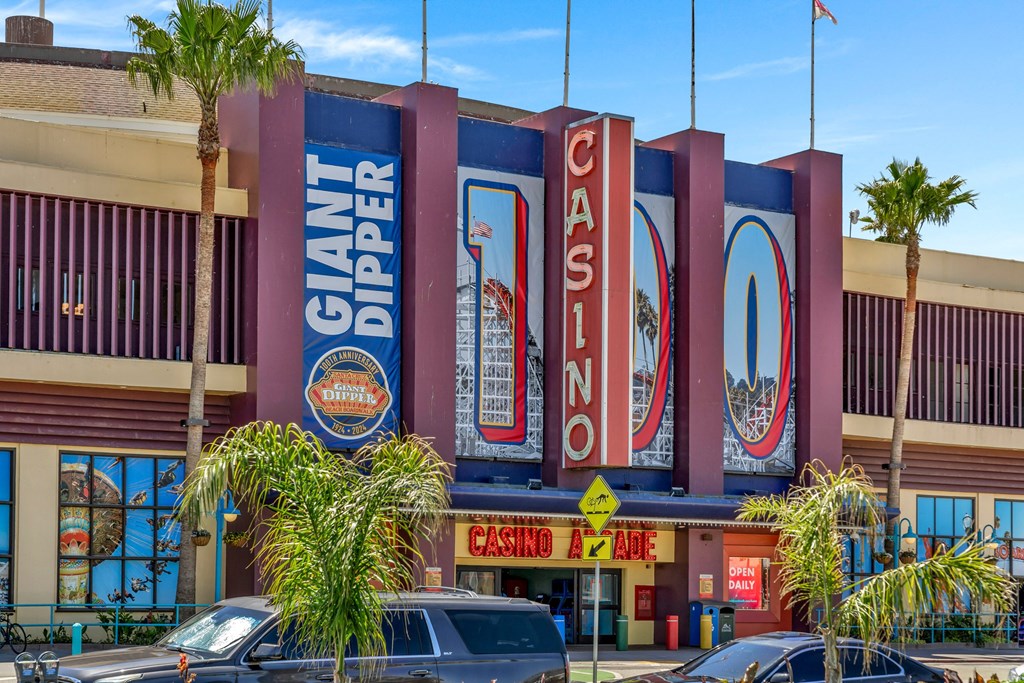 the exterior of a restaurant with large signs on the side of the building