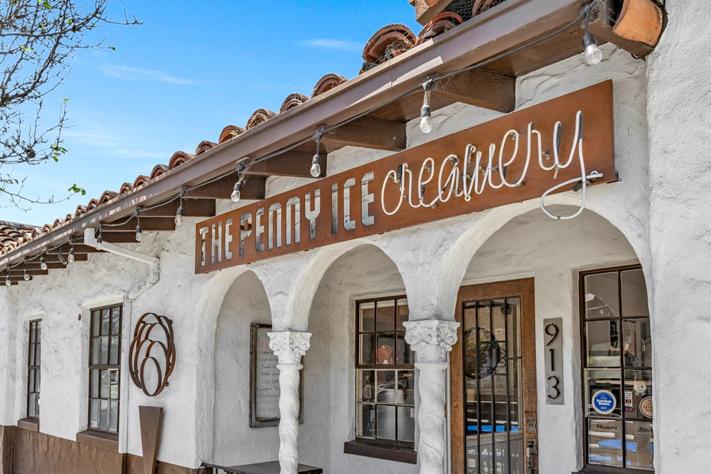 a white building with a sign that reads the holy life collective