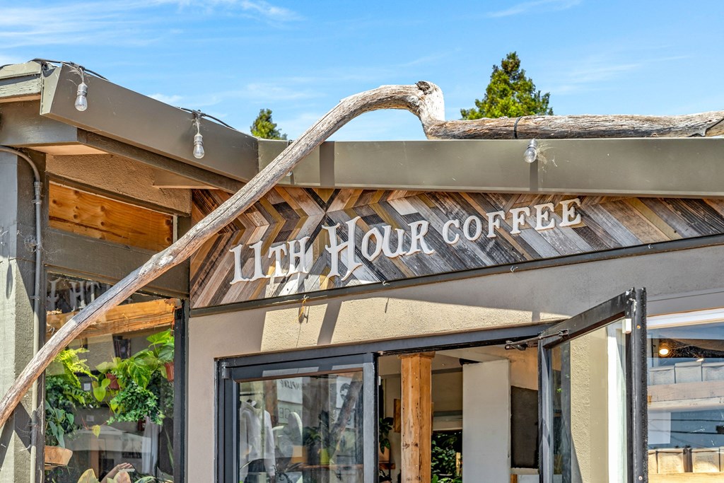 a building with a sign that reads juicy rock coffee