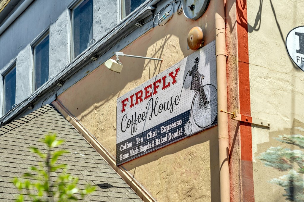a sign for a coffee house on the side of a building