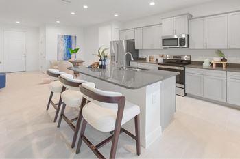 Kitchen with white cabinets at Fiore Townhomes, Venice