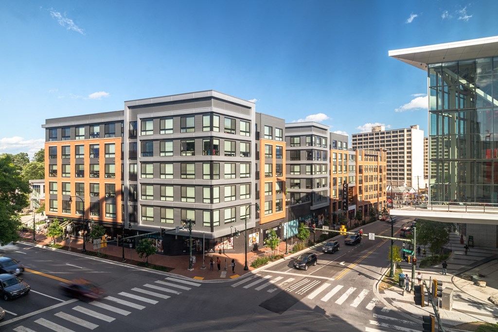 A city street with cars and buildings.