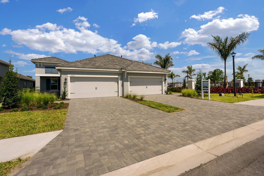 a house with a driveway and a garage door