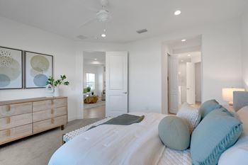 a bedroom with a bed and a dresser