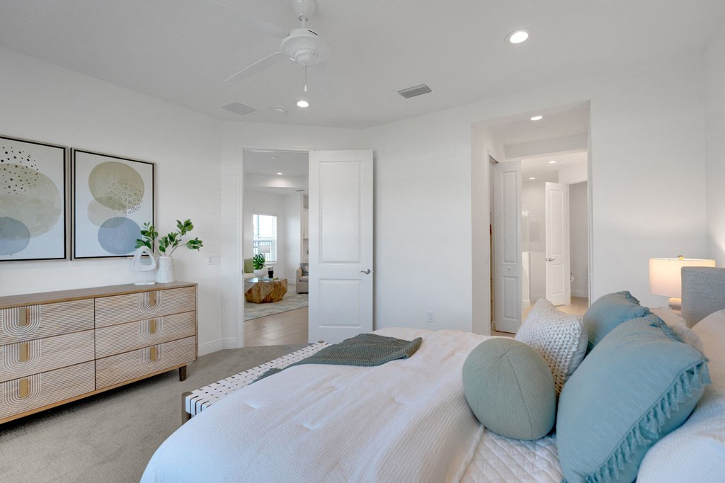 a bedroom with a bed and a dresser