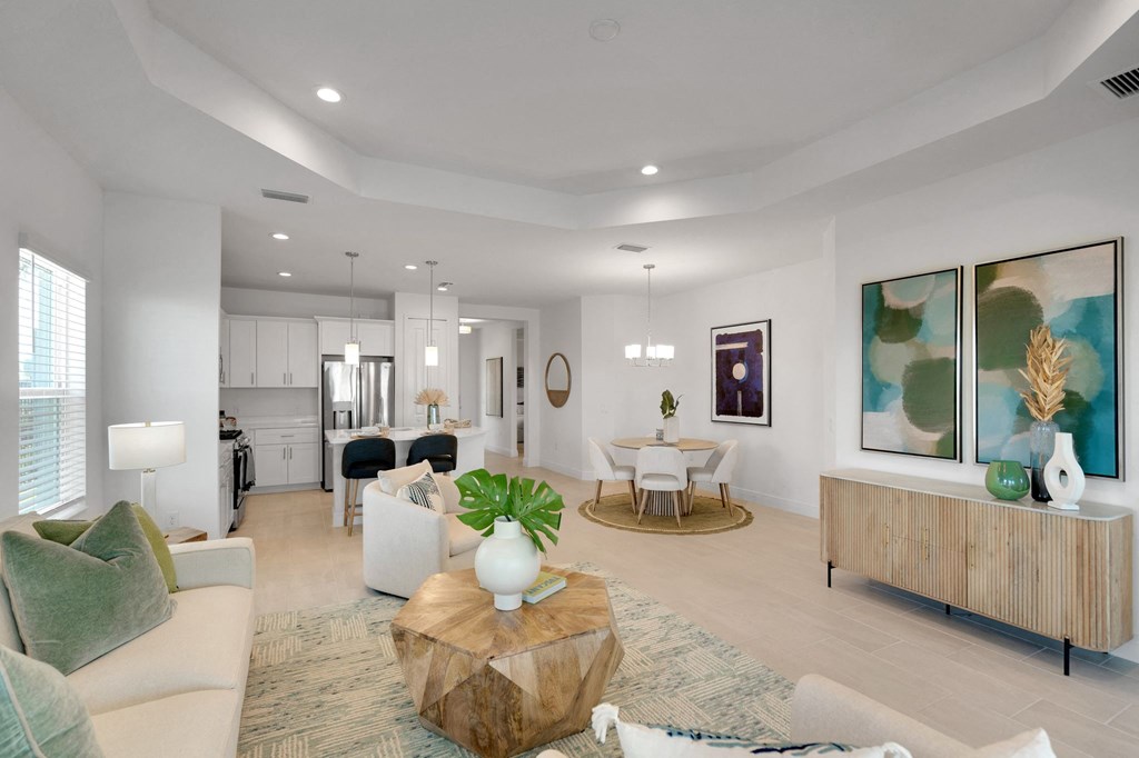 a living room with couches and chairs and a table