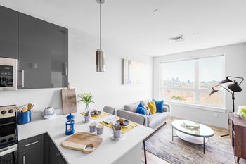 A modern kitchen with a view of the city.