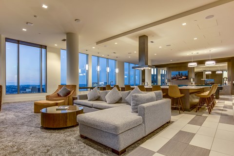 A living room with a grey sofa and a coffee table.