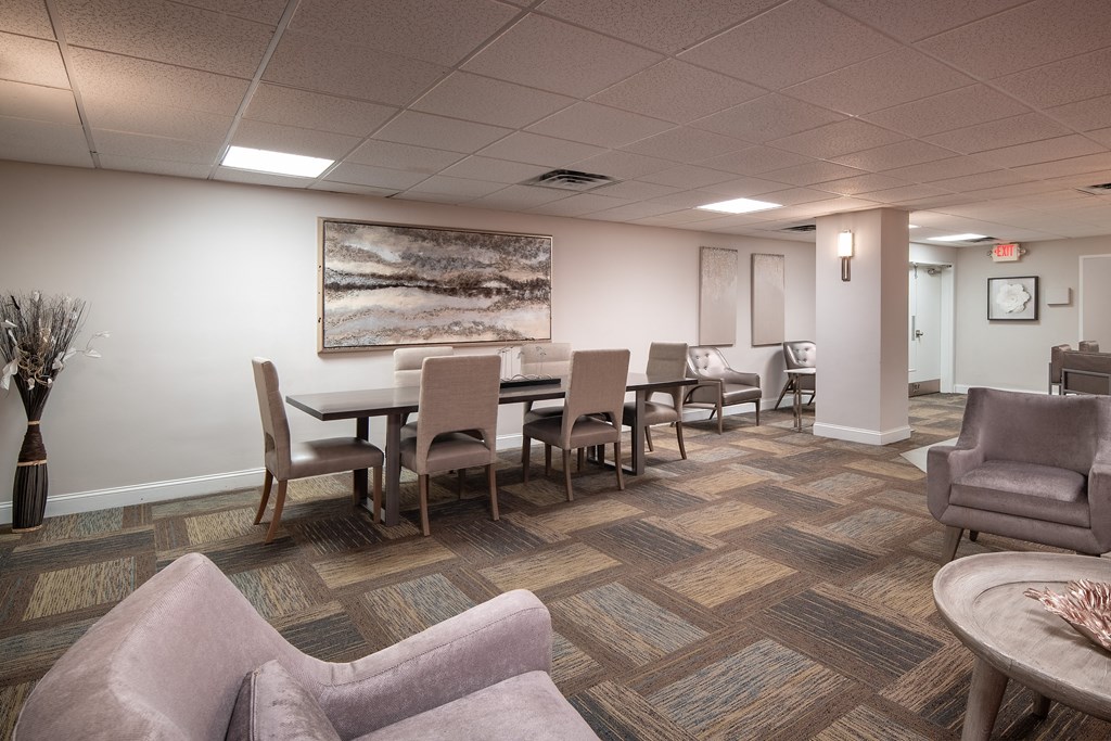 a dining room with a table and chairs