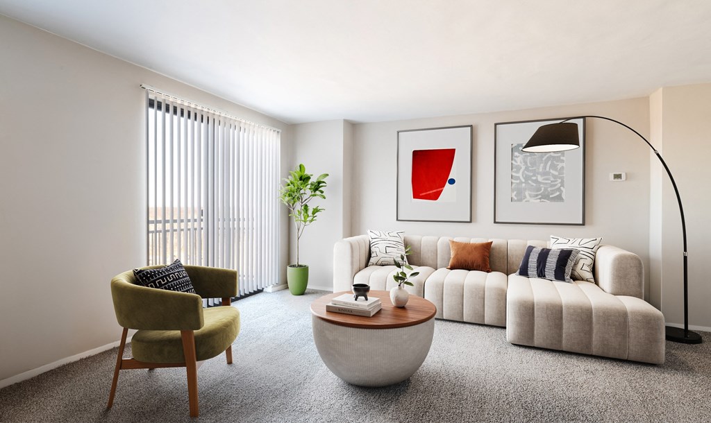 a living room with a white couch and a coffee table