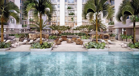 A pool surrounded by palm trees and lounge chairs.