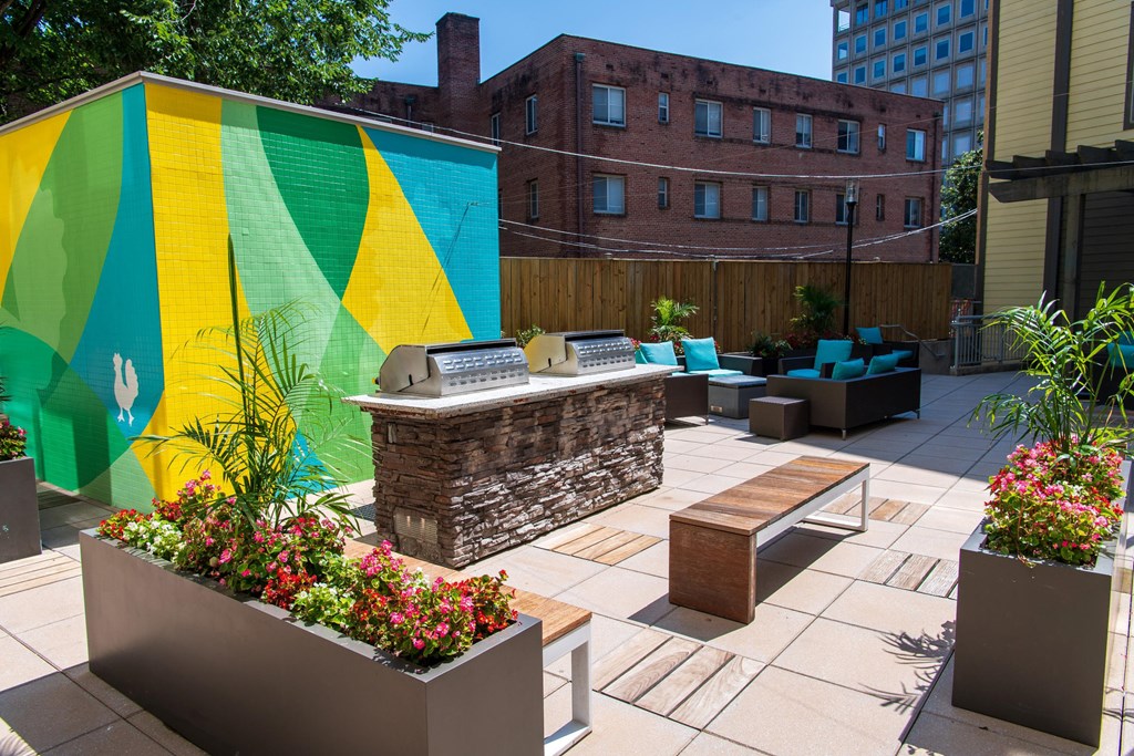 a patio with furniture and a large mural