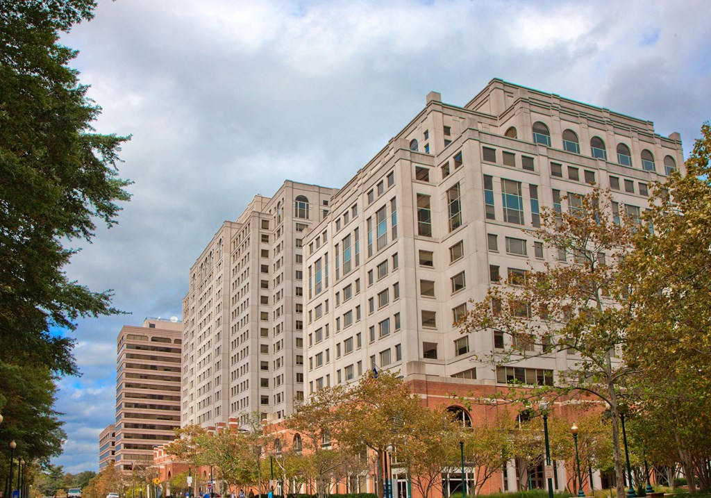 a large building with trees in front of it