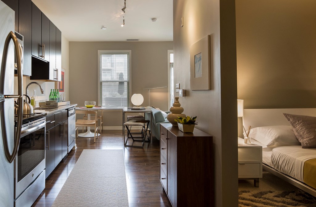 a small apartment with a kitchen and a living room