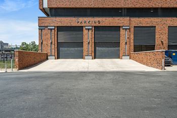 A brick building with the word "PARKING" on it.
