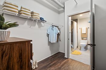 A bathroom with a towel rack and a toilet.