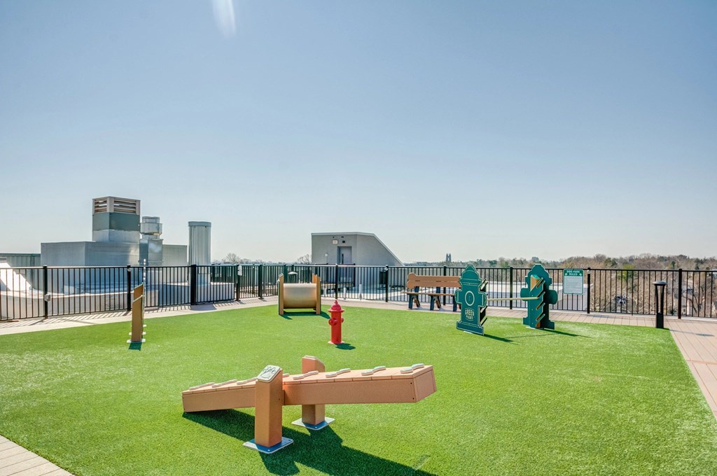 A park with a bench and a fire hydrant.