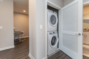 A white washer and dryer in a laundry room.