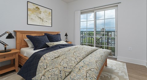 A bedroom with a large bed and a view of the ocean.