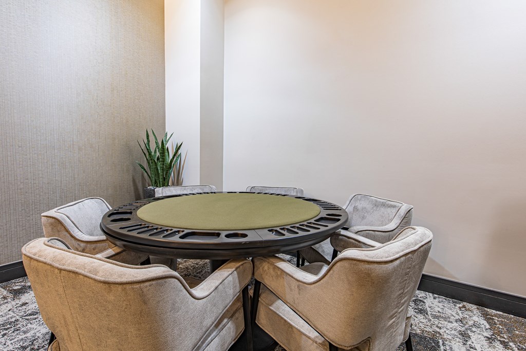 A round table surrounded by four chairs.