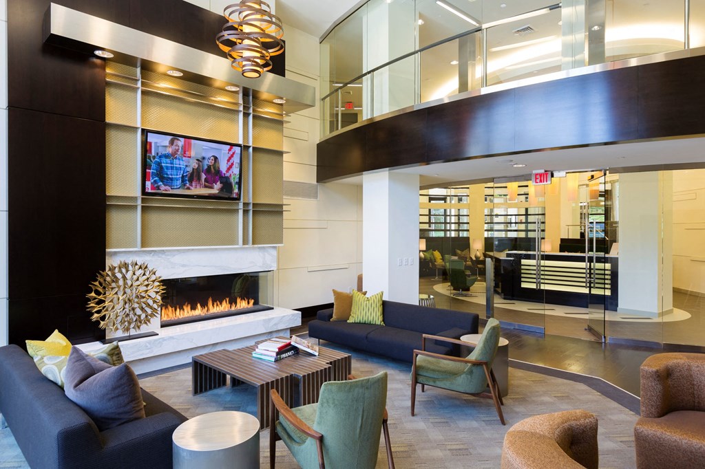 Lobby of Citron with fireplace and TV.