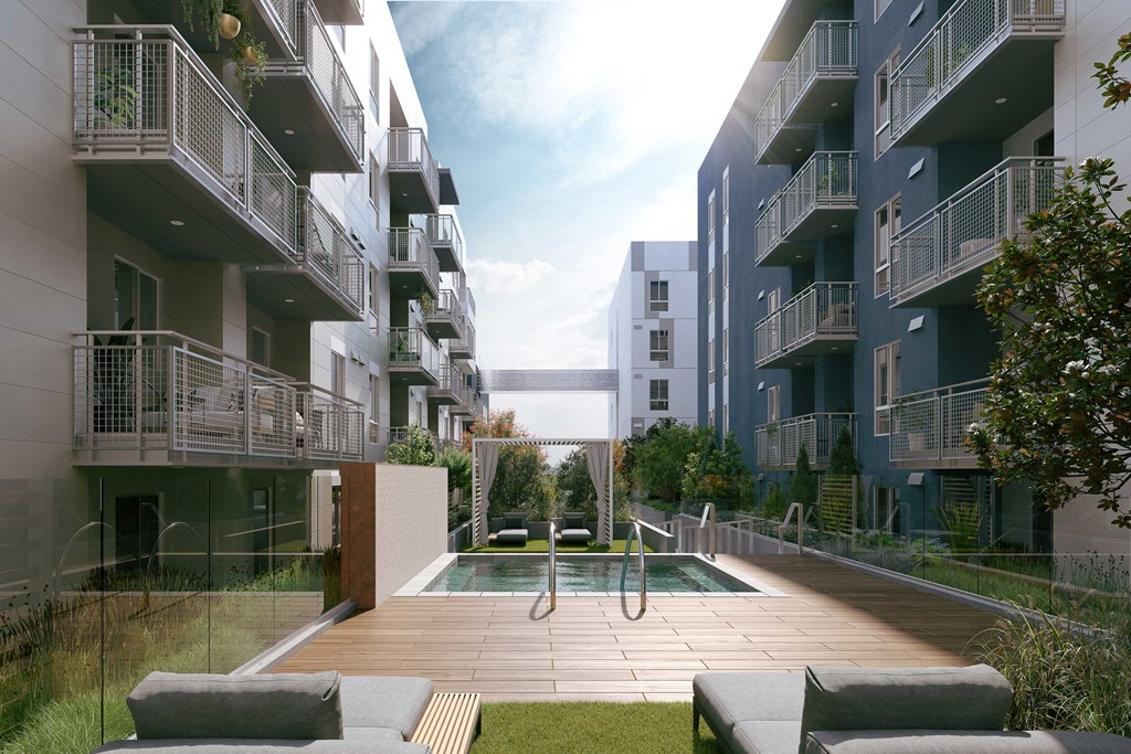 a courtyard with a pool in the middle of apartments
