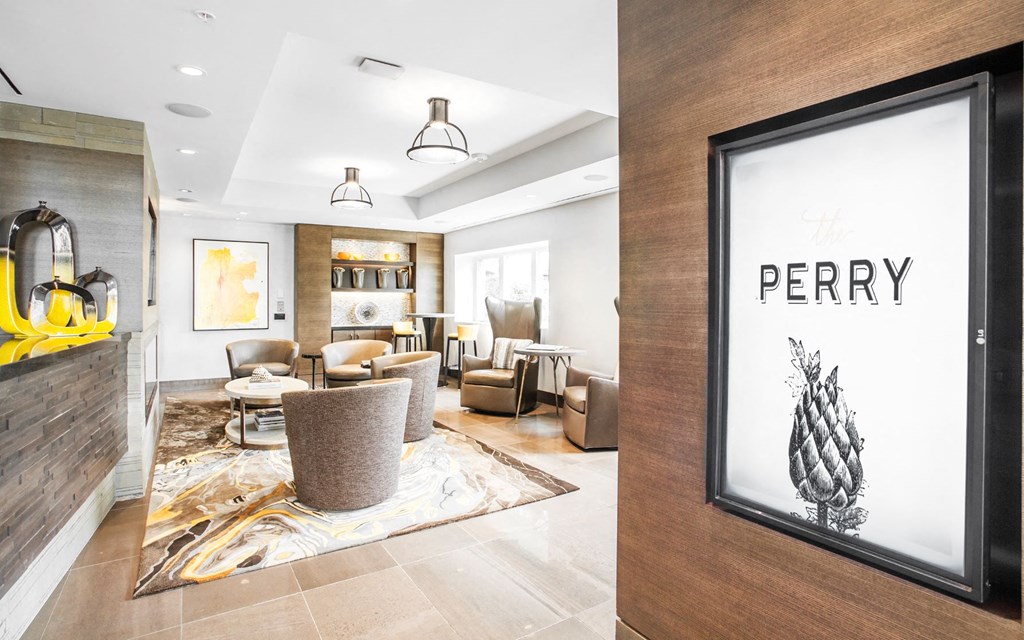 a living room filled with furniture and a large framed picture