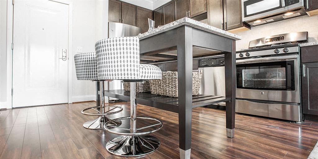 a kitchen with a counter top and a bunk bed