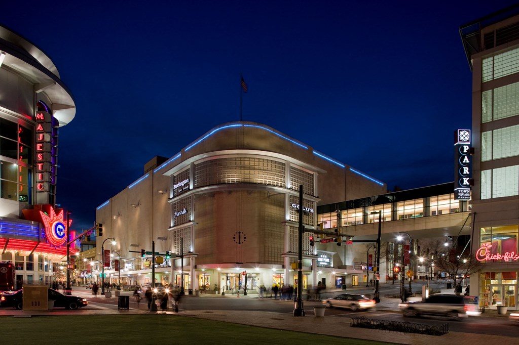 View of Citron at night with cars in front.