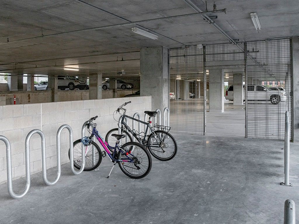 A bike is parked in a parking garage.