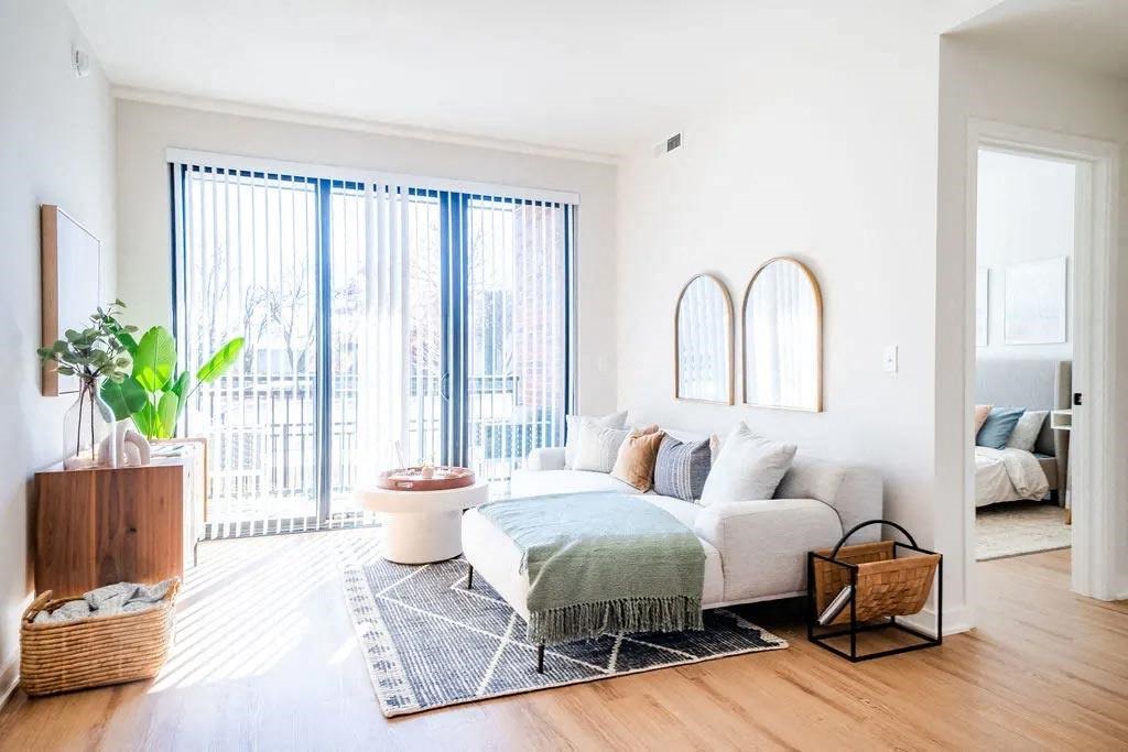 a living room with a couch and a bed